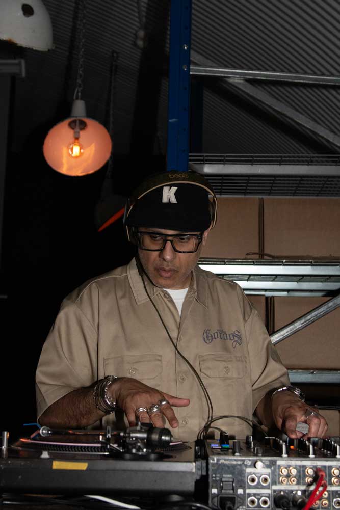 Man DJing on vinyl record decks